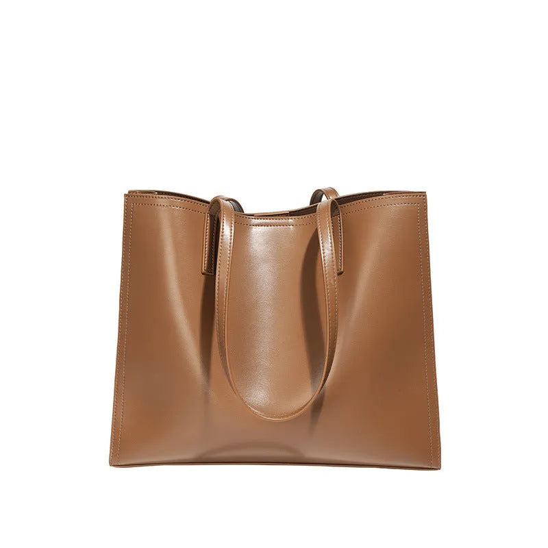 Genuine leather women's one shoulder handbag in a horizontal square shape showing internal compartments.
