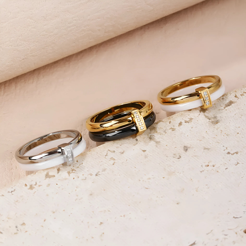 Women's titanium steel heart-shaped double ring with glossy stitching and inlaid zirconium detail.
