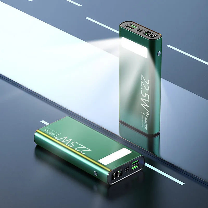 Black alloy power bank with LCD display showing battery level, featuring USB-A and USB-C ports.