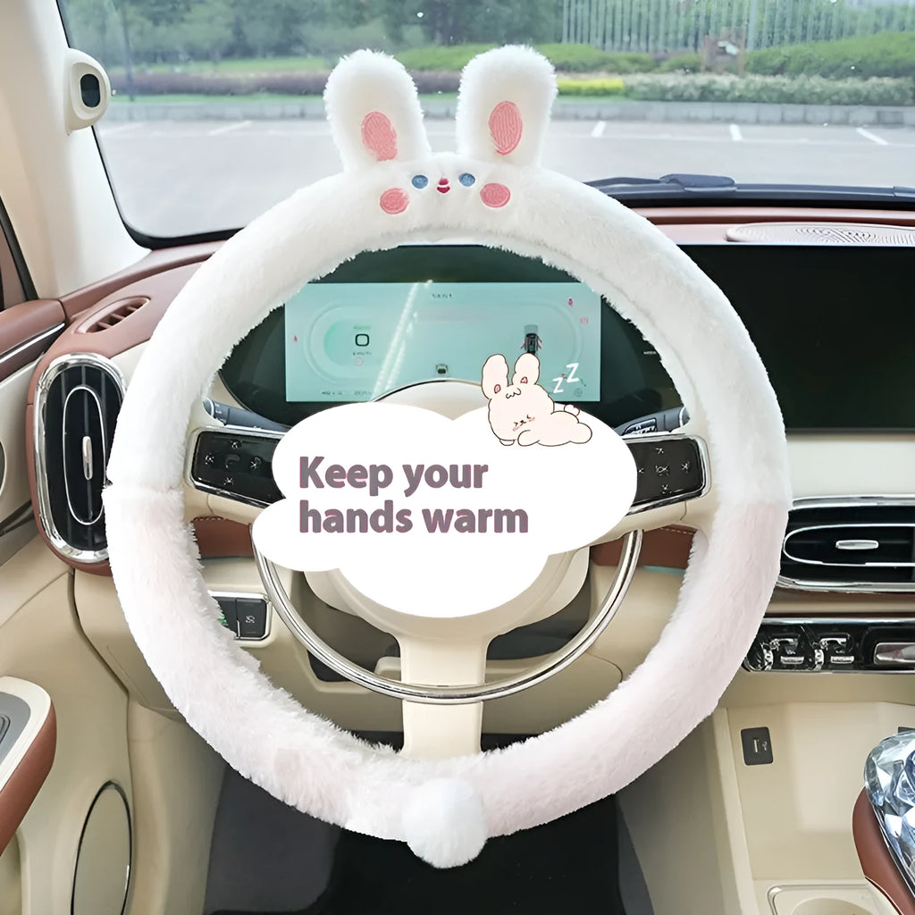 Plush rabbit fur winter steering wheel cover with cute embroidered panda design, shown fitted on a car steering wheel.