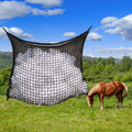 Black woven PE rope grid feeding bag hanging, sized for a horse.