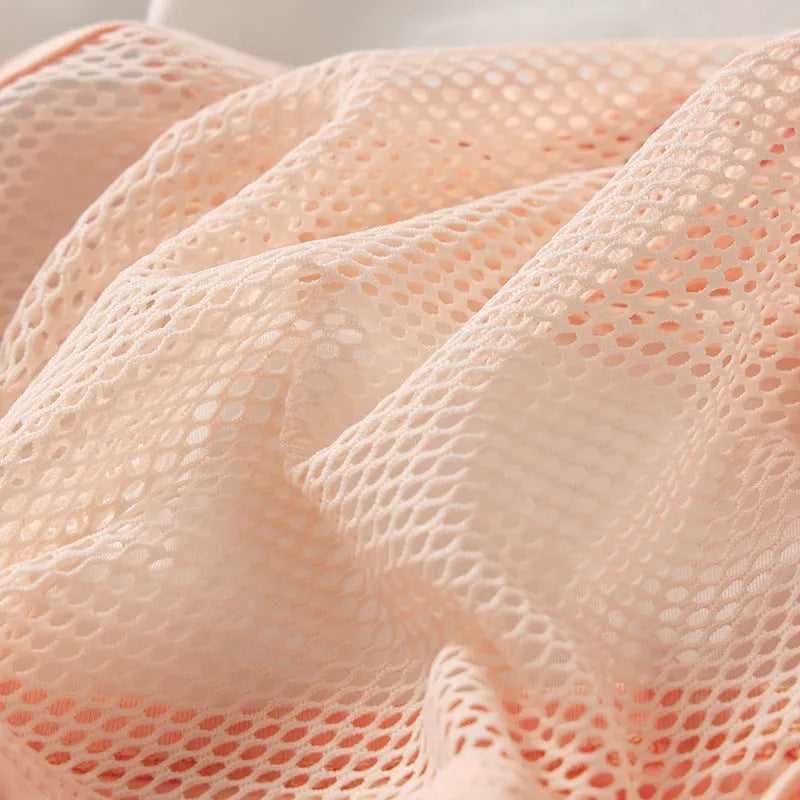 Men's solid colour low waist briefs in nylon mesh fabric on a white background.