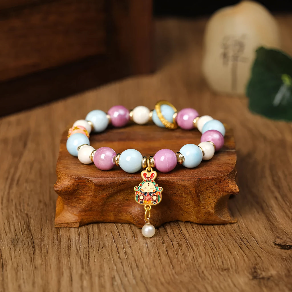 Handmade grey ceramic bracelet with rabbit charm and porcelain glaze finish