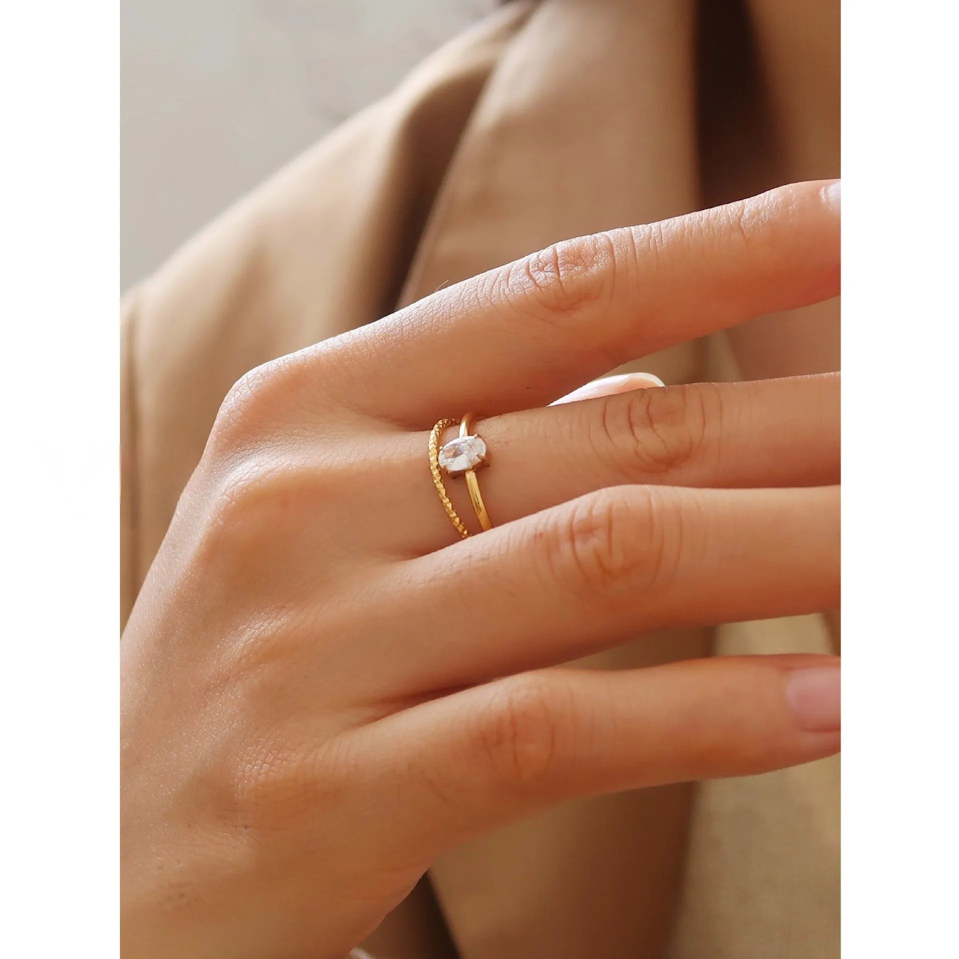 Golden electroplated stainless steel heart ring with oval design elements in women's sizes 5-8