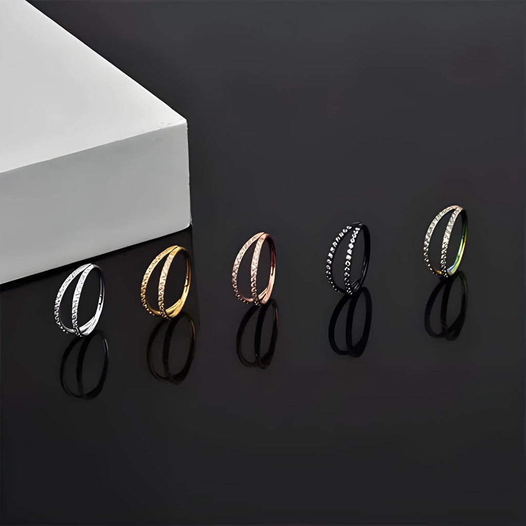 Close-up of a G23 titanium alloy lip ring with a diamond zircon finish in gold colour.