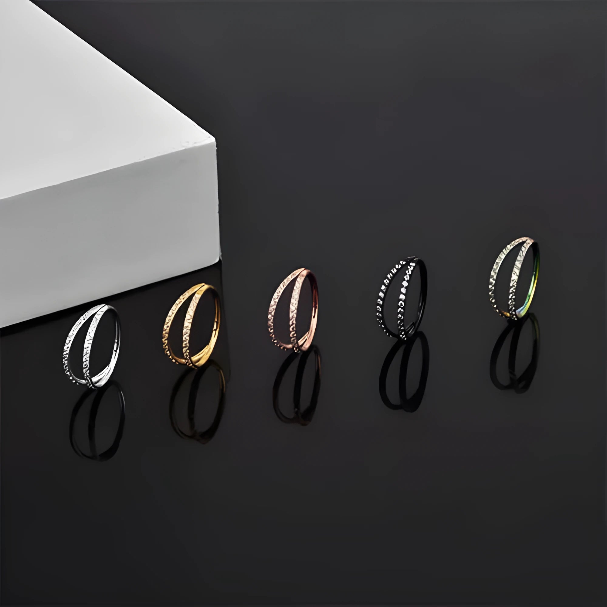 Close-up of a G23 titanium alloy lip ring with a diamond zircon finish in gold colour.