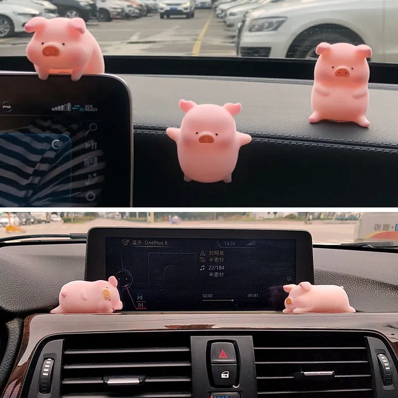 Small resin cartoon pig figurine car dashboard ornament measuring 6cm.