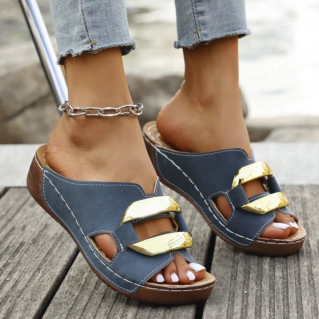 Roman style platform flip-flop sandals in a solid colour on a white background.