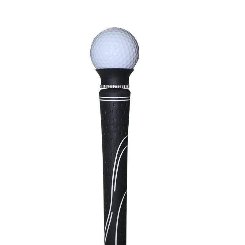 Black TPR golf ball suction cup picker with conventional size on a green surface