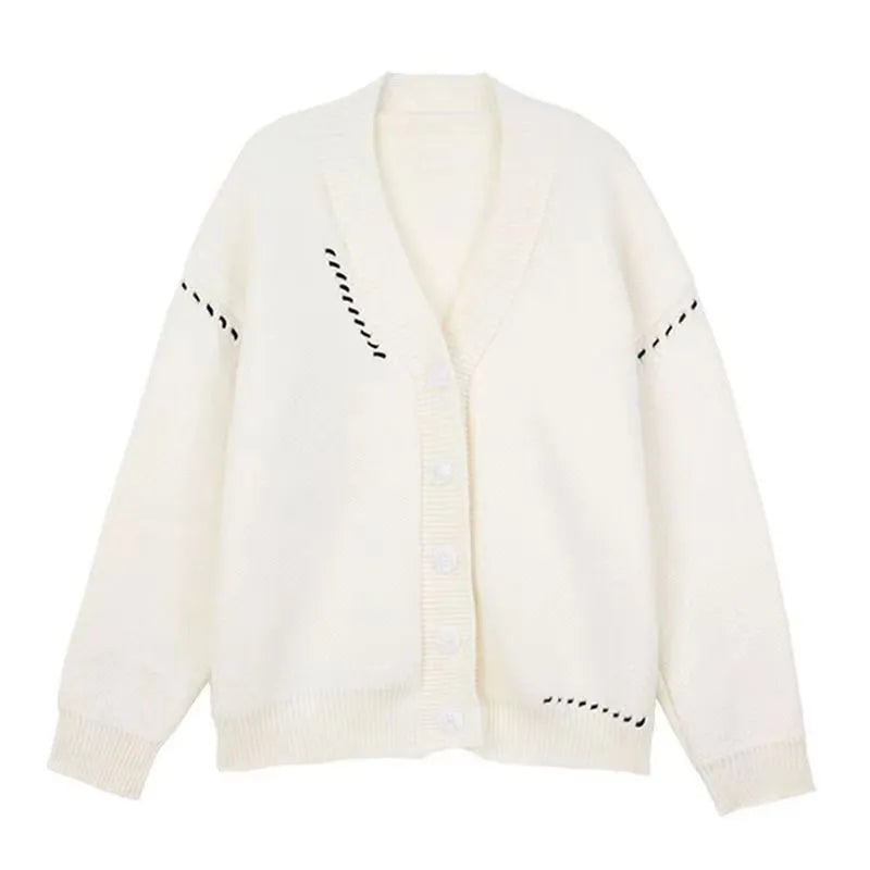 A women's loose-fit knitted cardigan coat in black, showing long sleeves and a solid colour design.