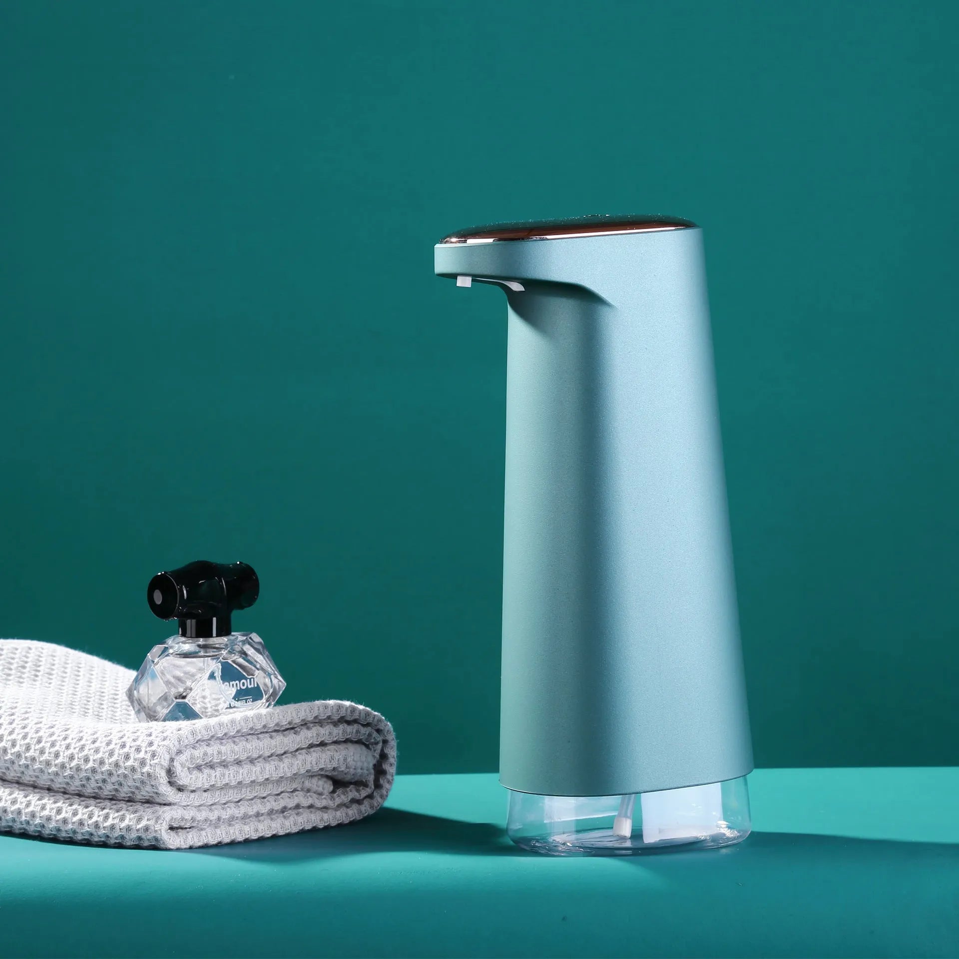 White automatic foam soap dispenser with sensor for touch-free operation on bathroom counter