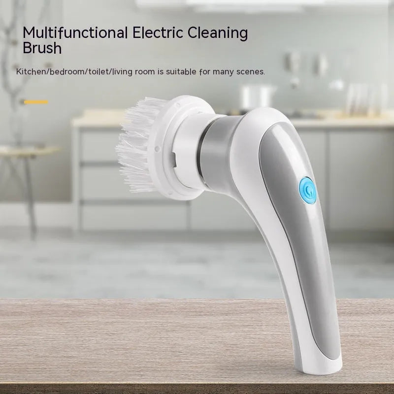 White cordless electric spinning cleaning brush with multiple brush heads on wall bracket