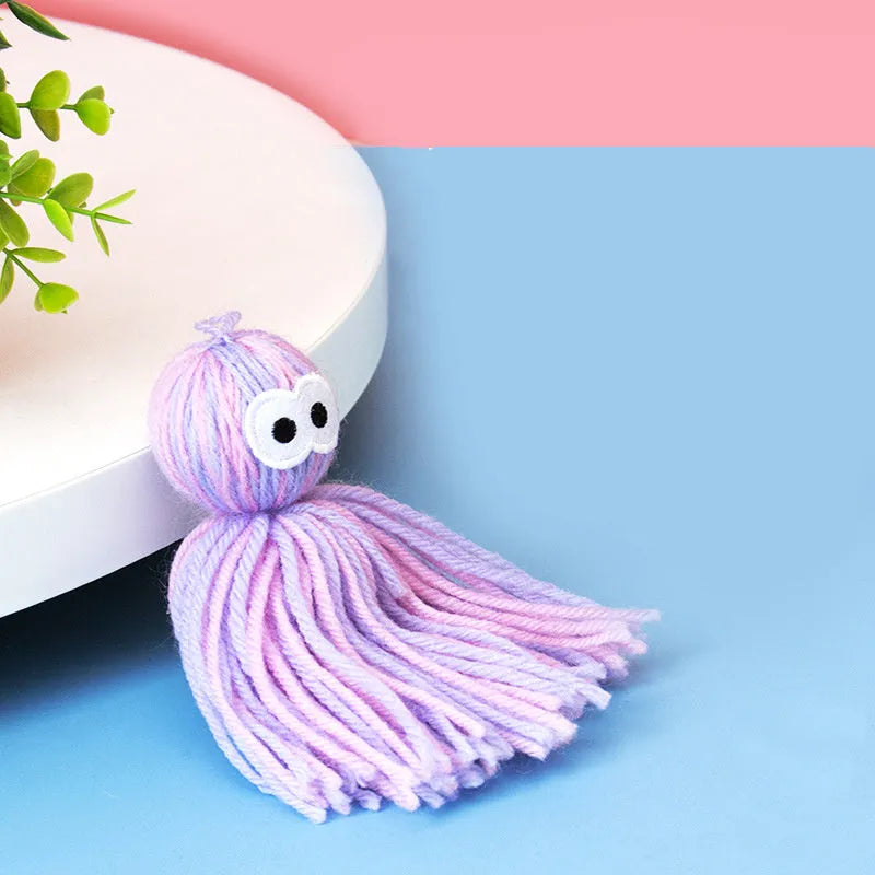 Hanging wool cat ball toy with teaser stick in blue grey, pink and blue, or pink purple colour options