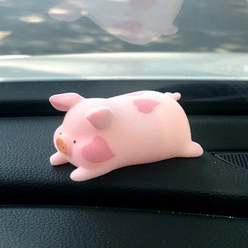 Small resin cartoon pig figurine car dashboard ornament measuring 6cm.