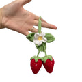 Handmade strawberry-shaped car pendant made with knitted cotton and hemp wool.