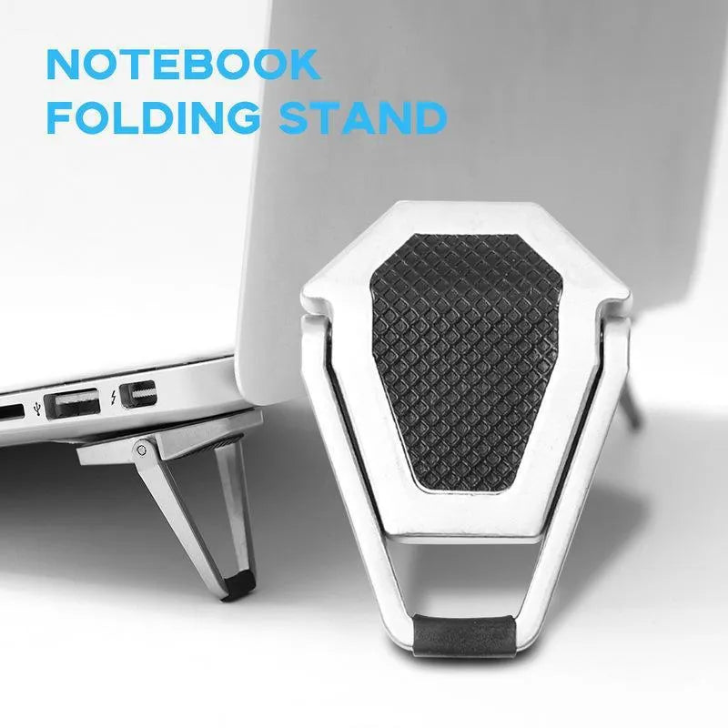 Small silver foldable aluminum laptop stand bracket with 3M adhesive strips on a white background.
