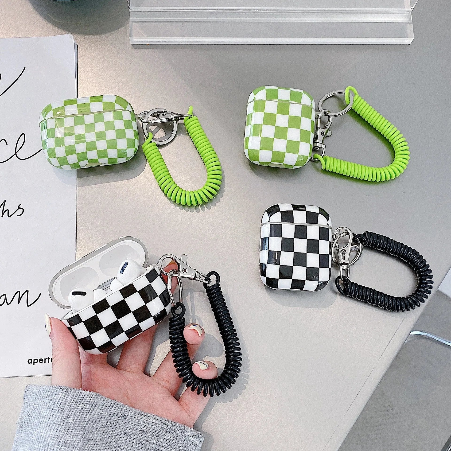 Black and green checkerboard pattern TPU case for Apple AirPods with optional pendant attachments