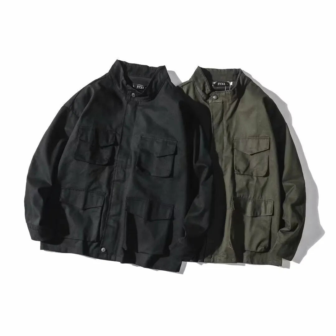 Men's multi-pocket workwear jacket in black or green, loose fit, long sleeve, sizes M to 3XL