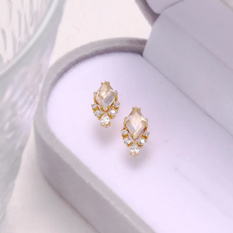 Geometric silver earrings with white crystal studs on 925 silver backing