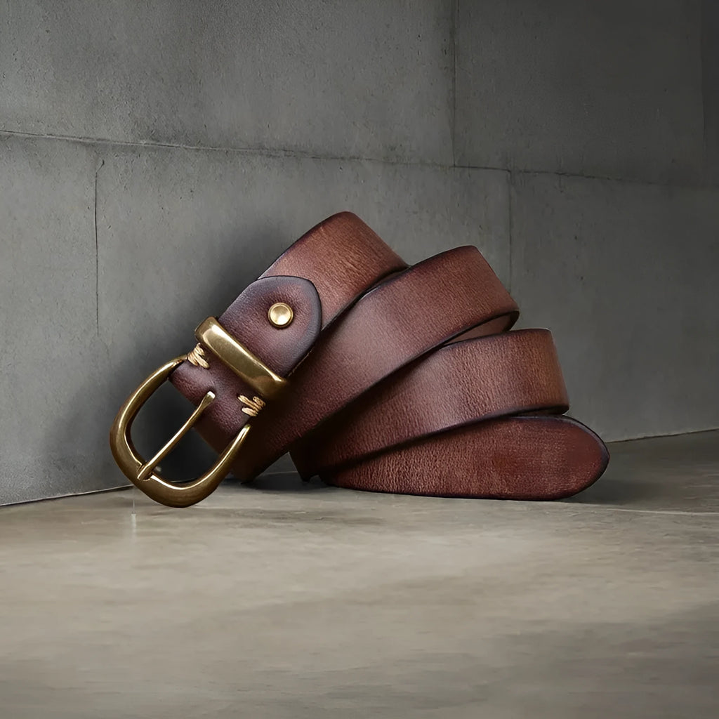 Men's casual leather belt in black with copper buckle showing length adjustment holes
