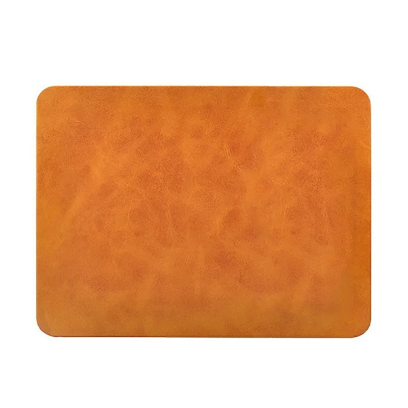 Brown leather and PU wireless charging mouse pad with Micro USB port for fast smartphone charging.