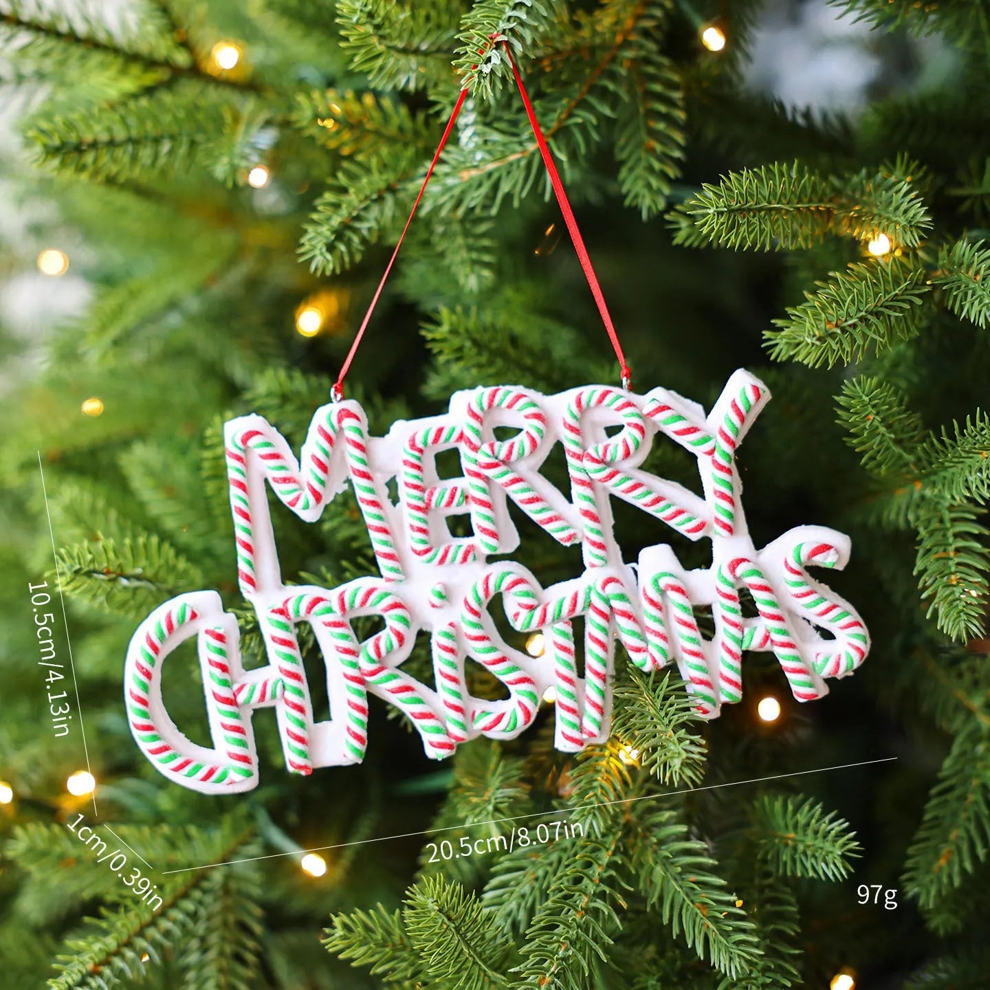 Merry Christmas letter plate polymer clay ornament in red and white hanging on Christmas tree branch