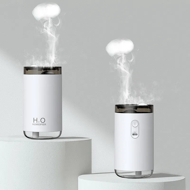 White USB jellyfish smoke ring humidifier with warm night light on a wooden desk