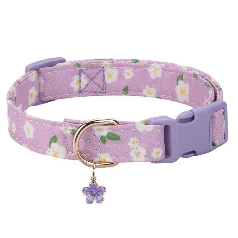 Floral polyester adjustable dog collar for traction in a pink colour, shown on a white background