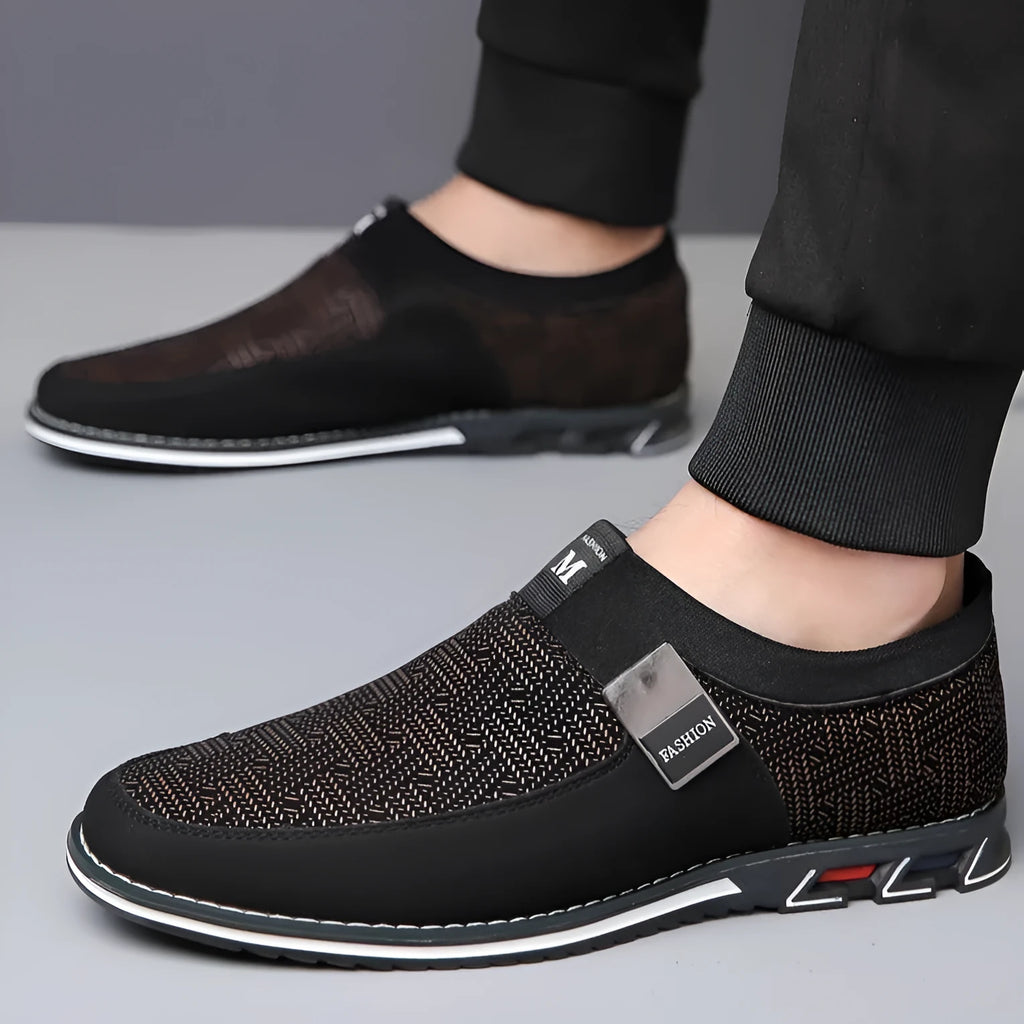Men's grey and white synthetic leather casual shoes with square toe and flat rubber sole.