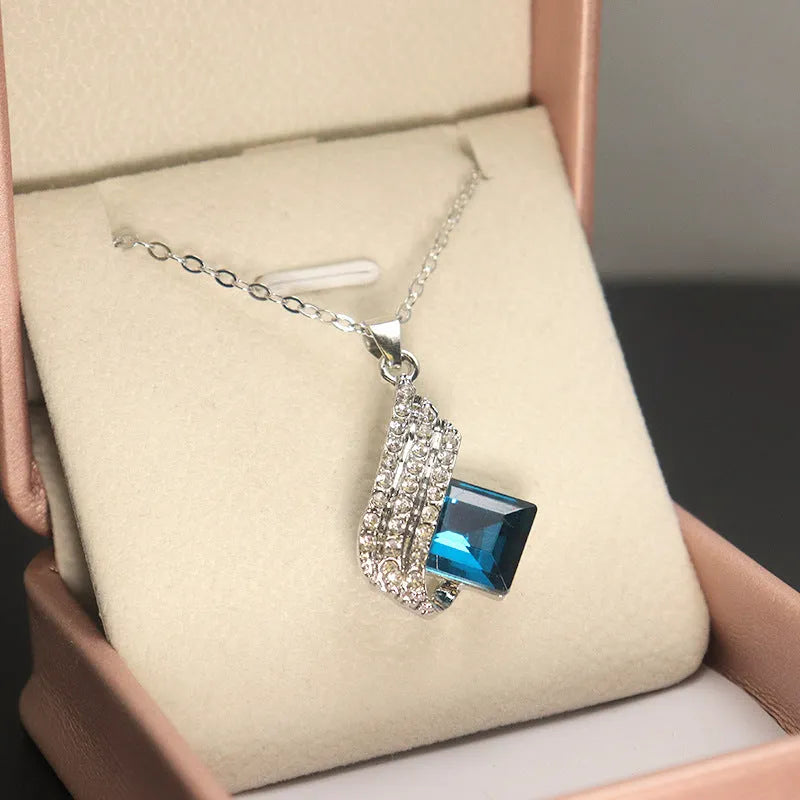 Women's electroplated necklace and earring set with alloy pendant and cross chain glass ornament