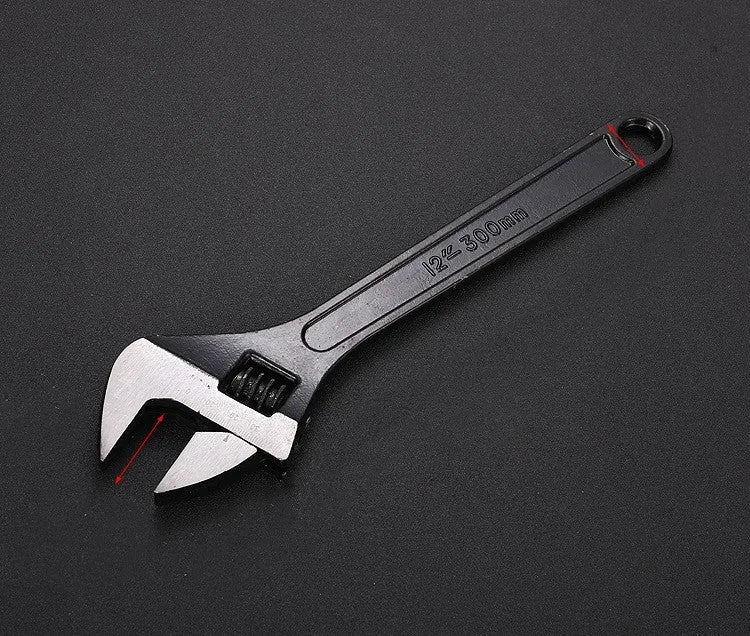 10-inch black high carbon steel adjustable open-end wrench on a workbench