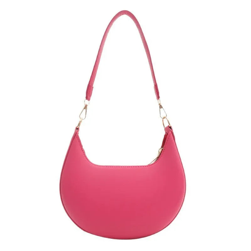 Round green one-shoulder underarm bag showing sewing line detailing and sandwich pocket design