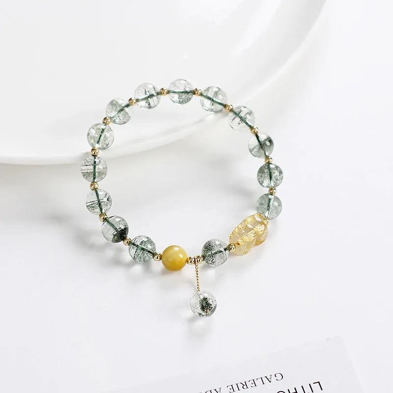 Green phantom quartz crystal bracelet with 8mm beads and gold accents in geometric ethnic style