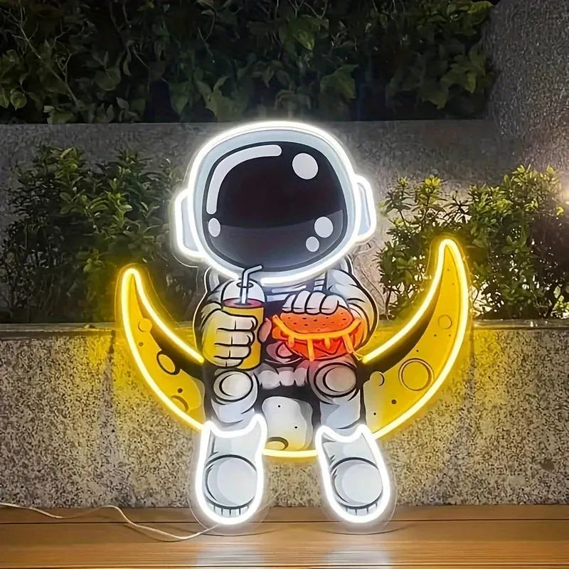 Wall mounted astronaut neon light with moon design measuring 30cm by 35cm