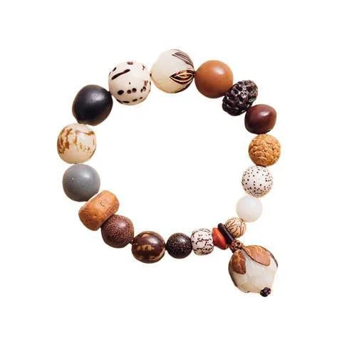 Handmade Bodhi seed bracelet with 18 natural beads on wrist, showing geometric national style design
