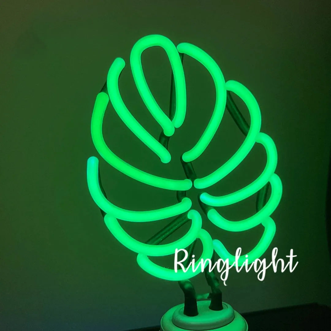 Minimalist bamboo-shaped desktop lamp with USB cable and green illumination