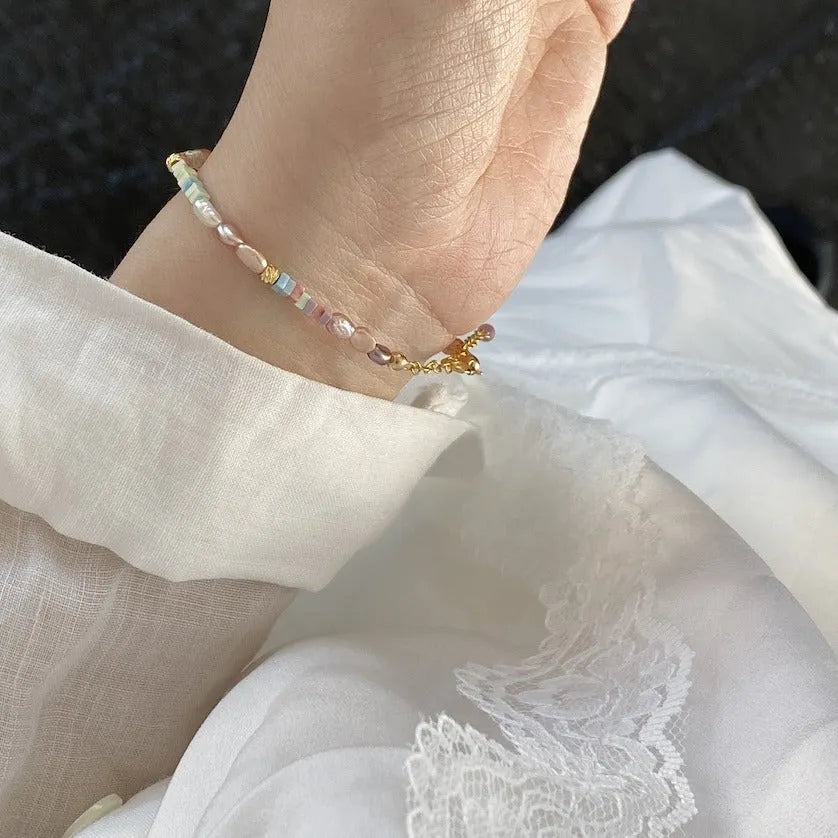 Women's natural pearl and silver bracelet and necklace set with U-shaped design and irregular format