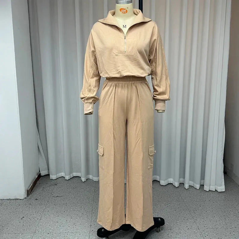 Women's light camel polyester two-piece work set with lapel top and wide-leg trousers on hanger