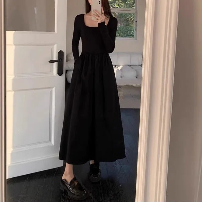 Black square collar knitted A-line dress with long sleeves and an elastic waist on a model.