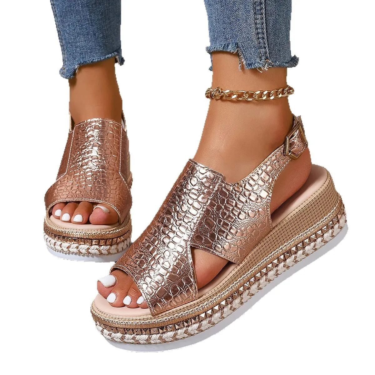 Gold women's Roman sandals with round hollow-out toe and an ankle buckle strap on a rubber sole.