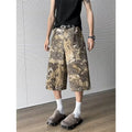 Yellow snake pattern camouflage cropped jeans on hanger showing cotton denim fabric