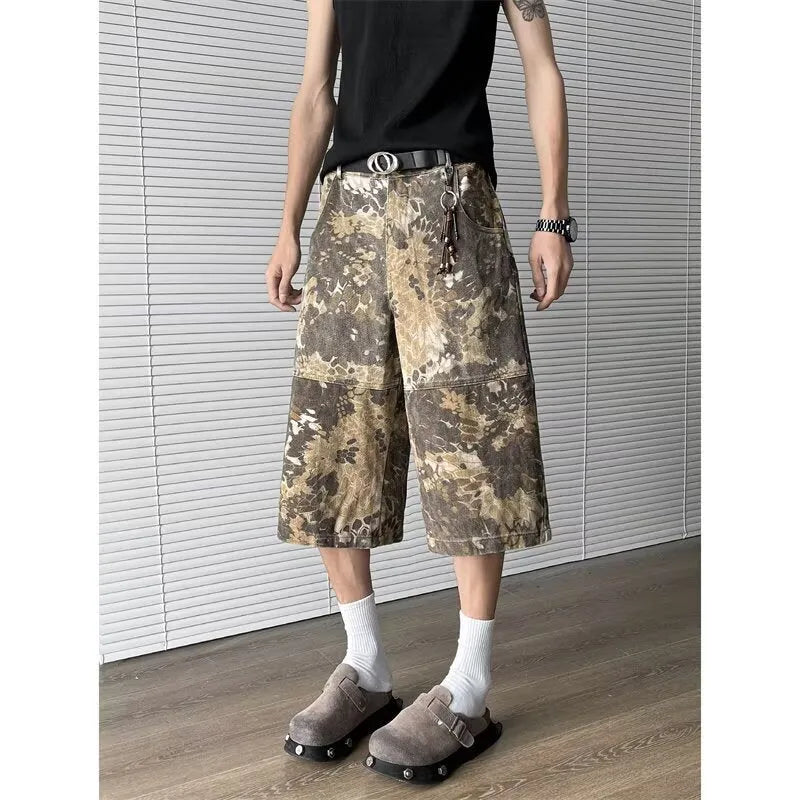 Yellow snake pattern camouflage cropped jeans on hanger showing cotton denim fabric