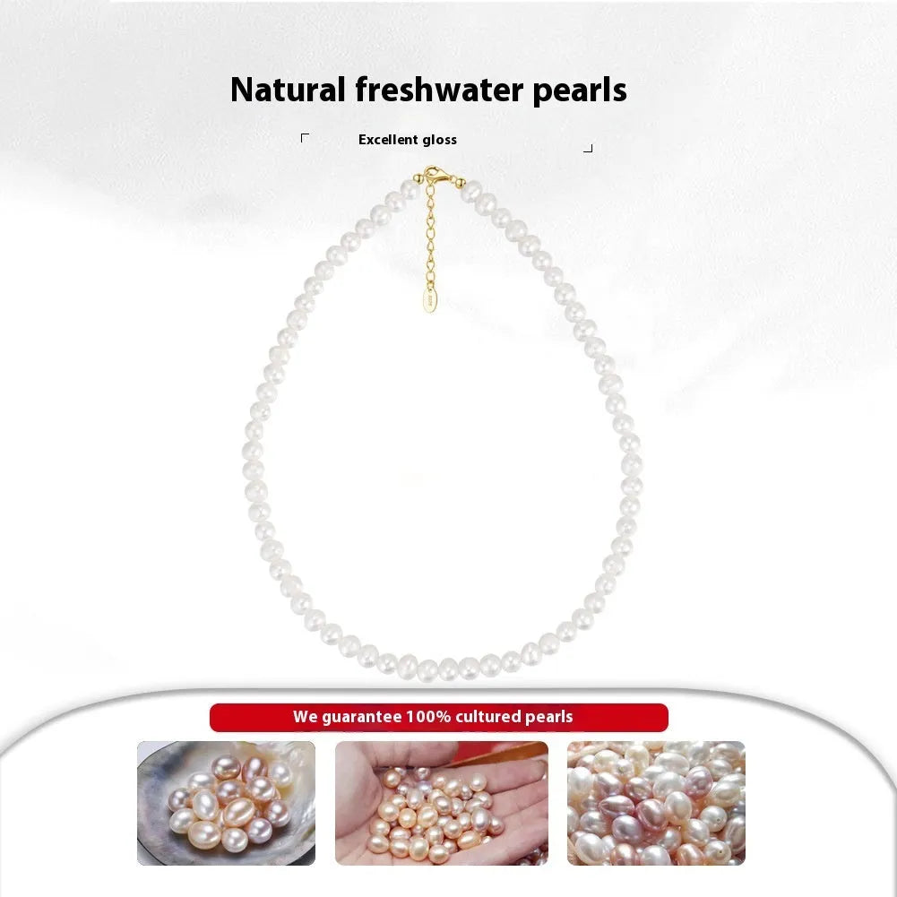 Women's silver necklace with round natural freshwater pearls on an adjustable chain.
