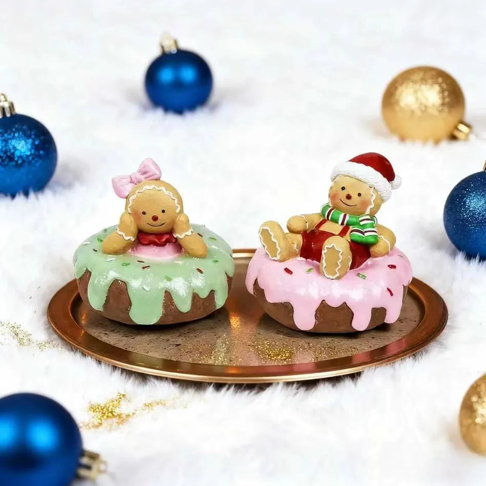 Hand drawn cartoon resin Christmas gingerbread man ornament with green bow design on white background