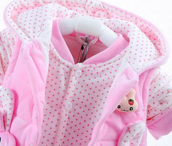 Girls' pink autumn winter three-piece clothing set with jacket, vest, and long trousers on a hanger.