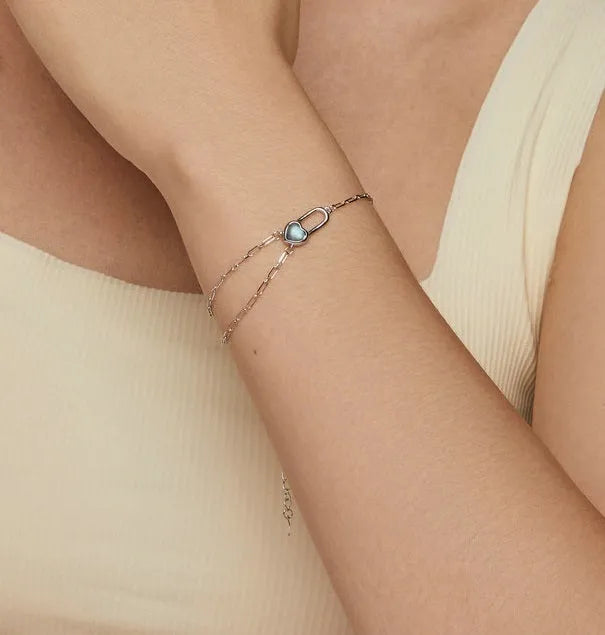 S925 sterling silver heart lock bracelet for women with electroplated finish on white background