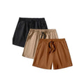 Three pairs of men's solid-colour drawstring shorts in black, khaki, and light brown laid flat.