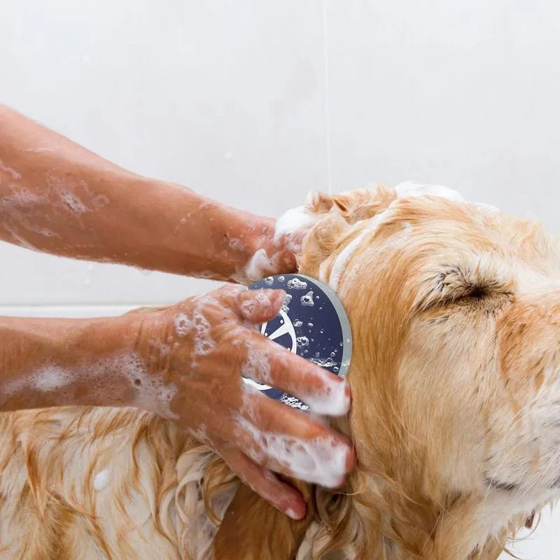 Blue dog shampoo brush with silicone massage points on head and ergonomic handle for bath time washing.