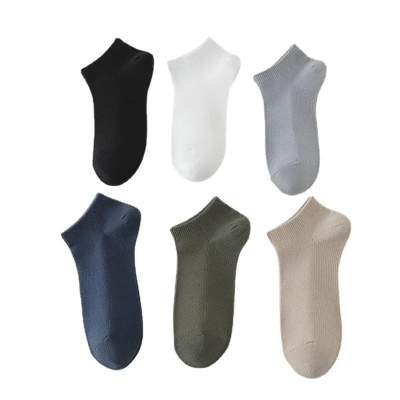 Men's solid colour low-cut polyester boat socks in various colours on white background