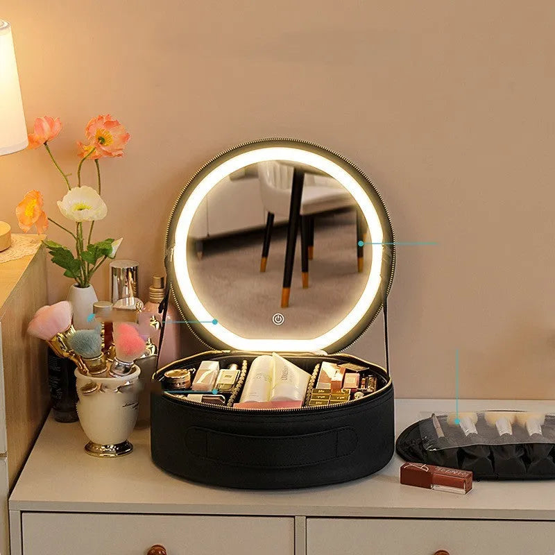 Round pink PU leather makeup bag with built-in LED illuminated mirror and internal cosmetic partitions open.